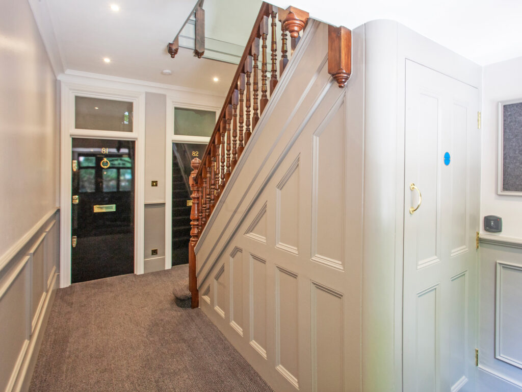 A view of the inside of one of the entrance blocks in Morshead Mansions, showing a flat door