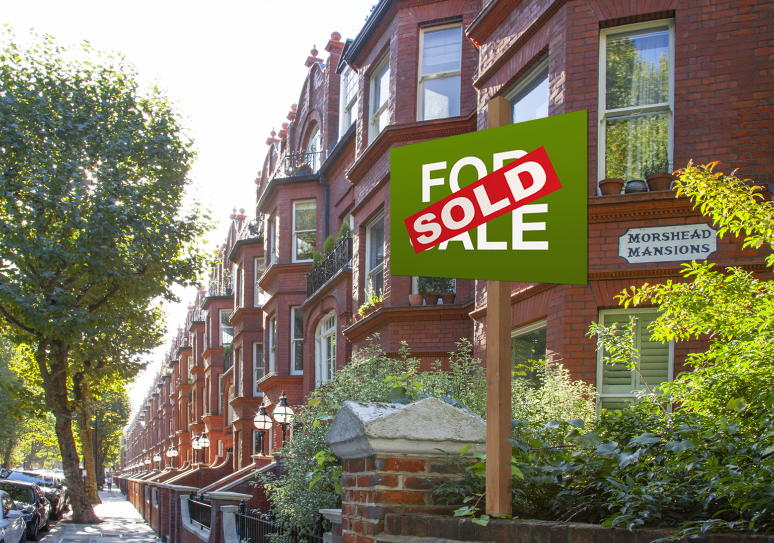 A for sale sign at the end of the Morshead Mansions block