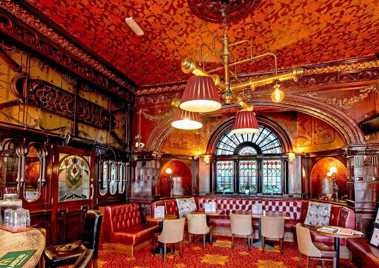 The spectacular interior of The Warrington Hotel, featuring Art Deco fittig and lighting and rich colours. A truly ourstanding Maida Vale pub